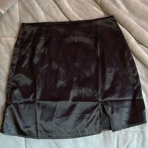 FREE WITH $10+ PURCHASE Black satin skirt with slit